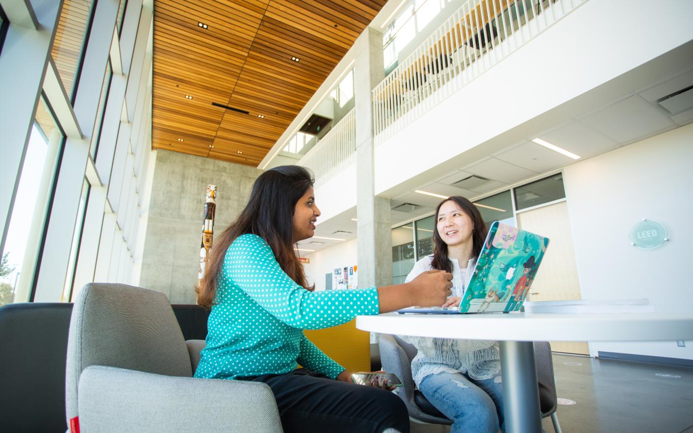 Two students chatting together.